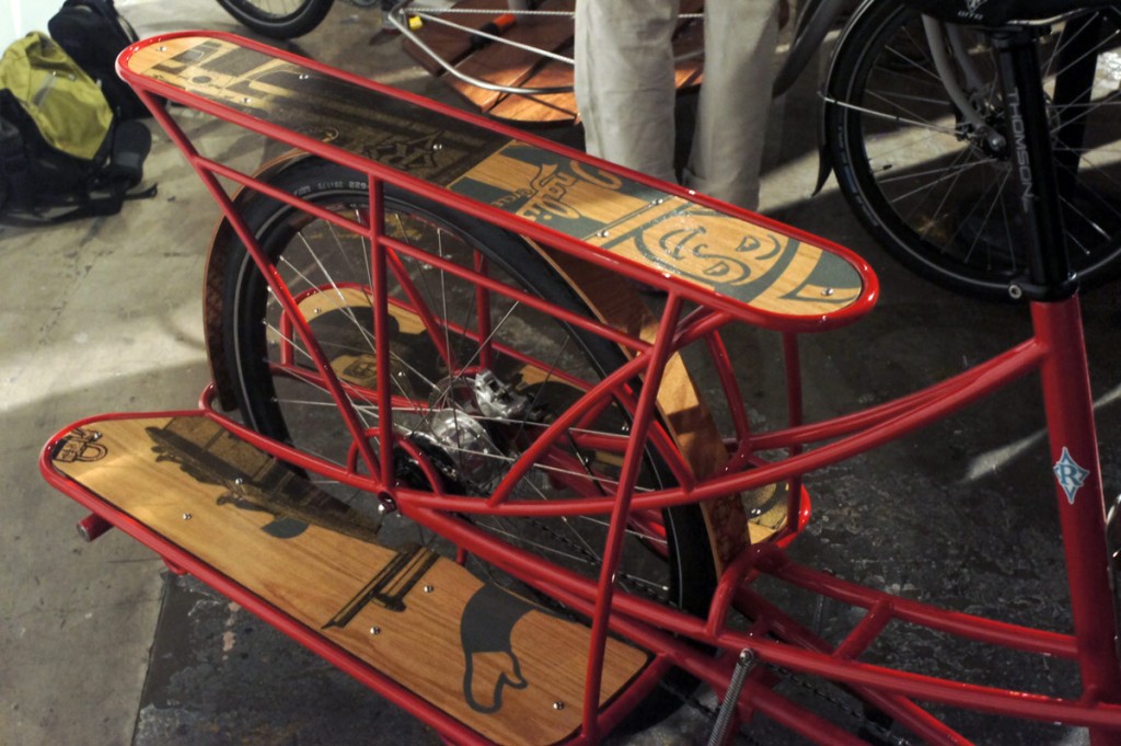 screenprinted decks on a red Retrotec cargo bike